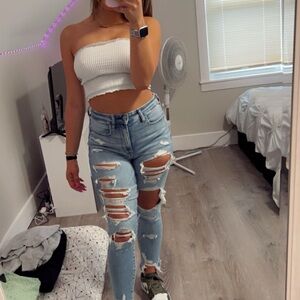 White Tube Top and Ripped Light Blue Jeans
